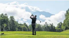  ??  ?? BELOW A golfer tees off at Niseko Village in Hokkaido.