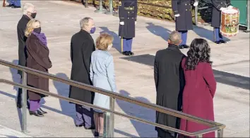  ?? Pool / Getty Images ?? Former President Bill Clinton with wife, former Secretary of State, Hillary Clinton, from left, former President George W. Bush with his wife Laura, former President Barack Obama and his wife Michelle at the Arlington National Cemetery Wednesday as part of inaugural ceremonies for President Joe Biden.