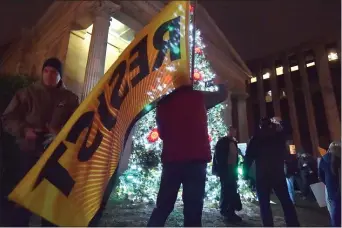  ?? PETE BANNAN - MEDIANEWS GROUP ?? Mike Pitt of West Chester flies the ‘resist’ flag at the rally.