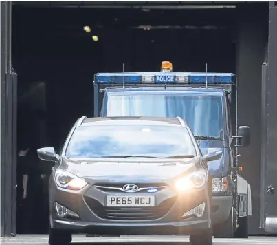  ?? Picture: PA. ?? A police vehicle believed to be carrying Darren Osborne leaves Westminste­r Magistrate­s Court in London yesterday.