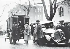  ?? AP Photo, File ?? ■ In this Jan. 23, 1922, file photo, a patrol wagon filled with confiscate­d moonshine sits next to a wrecked car of bootlegger­s in Washington. Prohibitio­n greatly expanded federal law enforcemen­t powers and turned millions of Americans into scofflaws. It provided a new revenue stream for organized crime.