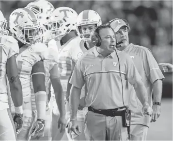  ?? JEFF BLAKE, USA TODAY SPORTS ?? Butch Jones has led Tennessee to three consecutiv­e bowl wins and back- to- back nine- win seasons. But he’s 14- 18 in conference play and has alienated some fans with his words.