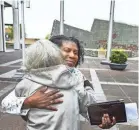  ?? MARK WEBER/THE COMMERCIAL APPEAL ?? Dr. Katherine Lawson (right) receives a hug from Pat Murrell (left) after giving speaking at Memphis Child Advocacy Center Children's Memorial Flag Raising event at Civic Center Plaza in 2016.