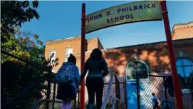  ?? JOHN TLUMACKI/GLOBE STAFF/FILE ?? Boston officials are planning to merge the Shaw (left) and Taylor schools next year. In 2025, they plan to merge Roslindale’s Sumner and Philbrick (right) schools.