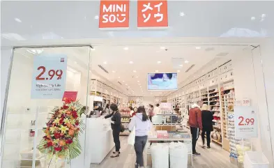  ?? PETER J. THOMPSON / FINANCIAL POST ?? Chinese dollar store chain Miniso is one of roughly 50 internatio­nal retailers that opened stores in Canada in 2017.