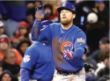  ??  ?? Ben Zobrist, who had three hits in each World Series game, reacts after his RBI triple in the fifth inning Wednesday.
| EZRA SHAW/ GETTY IMAGES