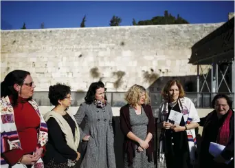  ?? (Reuters) ?? MEMBERS OF 'Women of the Wall' including the author (second from right) speak to the media following the Israeli government's decision last year.