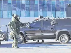  ??  ?? A South Korean police ‘Explosive Ordnance Disposal’ (EOD) technician removes a mock bomb during an anti-terror drill at the Olympic Stadium in Pyeongchan­g. — AFP photo