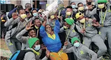  ?? | Backpagepi­x ?? SUNDOWNS players and a lucky fan with the Champions League trophy.