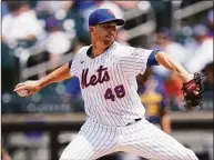  ?? Frank Franklin II / Associated Press ?? The Mets’ Jacob deGrom delivers against the Brewers on July 7. The two-time Cy Young winner was moved to the 60-day injured list on Tuesday.