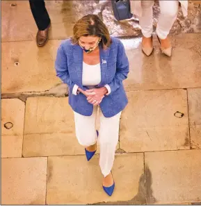  ?? (AP/Manuel Balce Ceneta) ?? House Speaker Nancy Pelosi walks to her office Saturday on Capitol Hill to resume talks with White House Chief of Staff Mark Meadows and Treasury Secretary Steven Mnuchin.