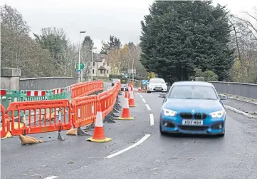  ??  ?? JOB DONE: The repaired bridge reopened on Saturday. Picture by Dougie Nicolson.