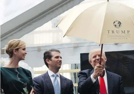  ?? JONATHAN HAYWARD/THE CANADIAN PRESS/FILES ?? Donald Trump holds an umbrella as he arrives for an announceme­nt with children Ivanka and Donald Jr. in Vancouver in June 2013. CNN reports the FBI is investigat­ing Ivanka’s role in the Trump Internatio­nal Hotel and Tower on West Georgia Street.