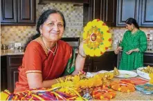  ?? Photos by Gary Fountain / Contributo­r ?? Lata Srivatsan shows off decoration­s planned for Holi celebratio­ns this week.