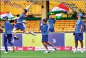  ?? PTI ?? Indian cricketer Navdeep Saini leaps in the air to catch a ball as teammates Rohit Sharma, Shikhar Dhawan and Shreyas Iyer look on, during a practice session ahead of the 3rd T20 match against South Africa, at Chinnaswam­y Stadium in Bengaluru on Saturday