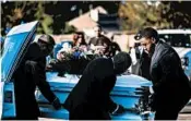  ?? MARIE DE JESUS/HOUSTON CHRONICLE ?? The casket of Jazmine Barnes, 7, is removed from a hearse Tuesday before her memorial service at Community of Faith Church in Houston. She was gunned down Dec. 30.