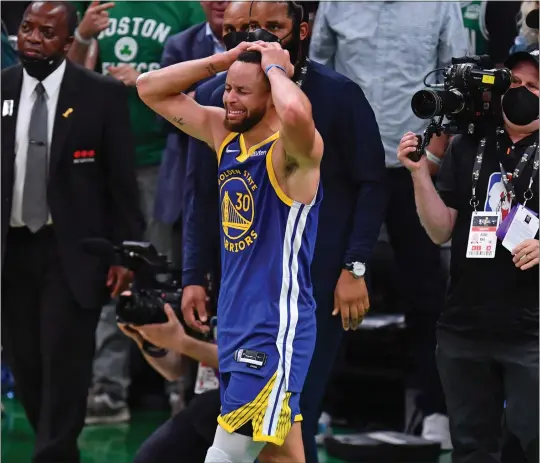  ?? JOSE CARLOS FAJARDO — STAFF PHOTOGRAPH­ER ?? Stephen Curry sheds tears after scoring 34points to lead the Warriors to their fourth NBA title in eight years with a Game 6victory over the Celtics on Thursday night at Boston.