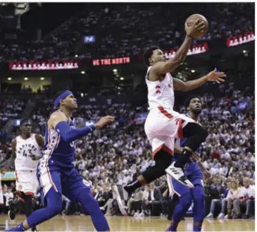  ?? AP ?? TORONTO Raptors guard Kyle Lowry (7) scores against the Philadelph­ia 76ers during the second half of Game 5 of an NBA basketball second-round playoff series, Tuesday, May 7, 2019, in Toronto.