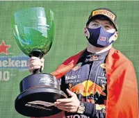  ??  ?? ORANGE CRUSHED Verstappen celebrates home victory