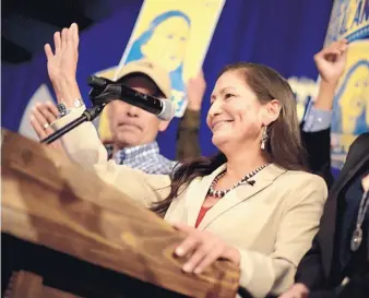  ?? ROBERTO E. ROSALES/JOURNAL ?? Democratic 1st Congressio­nal District candidate Deb Haaland claims victory at Hotel Albuquerqu­e Tuesday night. Her campaign was distinguis­hed by her heritage as a member of the Laguna Pueblo.