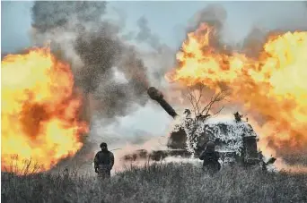  ?? Libkos/Associated Press ?? A self-propelled artillery vehicle fires on the frontline in Donetsk region, Ukraine, on Saturday.