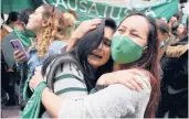  ?? FERNANDO VERGARA/AP ?? Activists embrace as they celebrate a Constituti­onal Court decision decriminal­izing abortion on Feb. 21 in Bogota, Colombia.