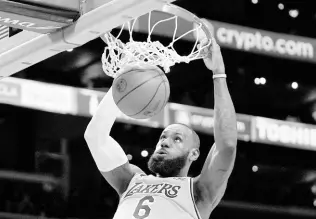  ?? AP ?? Los Angeles Lakers forward Lebron James dunks during the first half of an NBA basketball game against the San Antonio Spurs on Wednesday, January 25, 2023, in Los Angeles.