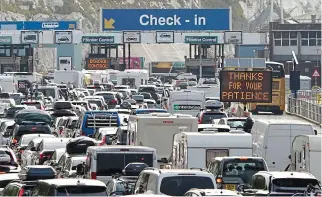  ?? ?? Gridlock: Holidaymak­ers caught up in the queues at Dover this weekend