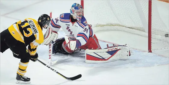  ?? DAVID BEBEE WATERLOO REGION RECORD ?? Kingston Frontenacs forward Brett Neumann scores Sunday against Kitchener Rangers goalie Luke Richardson. Neumann recorded a hat trick in the Frontenacs’ 4-1-victory.