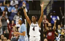  ?? Gerry Broome / Associated Press ?? Aliyah Boston celebrates after helping South Carolina defeat North Carolina. She had 28 points and 22 rebounds.