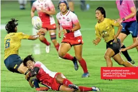  ??  ?? Japan produced some superb tackling during the Women’s Cup final