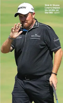  ?? GETTY ?? Sink it: Shane Lowry enjoys his birdie on the 9th