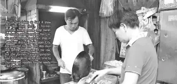  ??  ?? This picture taken on Sept 4 show Yen Wei-shun (left), a former criminal turned noodle shop owner for charity, and his mother Yen Linyin cooking noodles at their shop in Panchiao district, New Taipei City. For most of his life Yen Wei-shun was on the wrong side of the law, but the former Taiwan gangster says he is making up for lost time by churning out noodles for the needy. - AFP photo