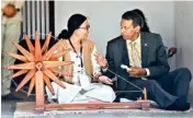  ??  ?? Seychelles President Danny Faure tries his hand on a spinning wheel or charkha', at Gandhi Ashram in Ahmadabad on Saturday