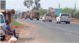  ?? AP ?? A U.S. military convoy arrives near Dahuk, Iraq, on Monday. Defense Secretary Mark Esper said Monday that U.S. troops leaving Syria will go to Iraq.