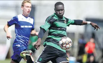  ?? JIM WELLS ?? Foothills FC forward Moses Danto, right, scores on his club’s first shot on net during exhibition PDL action against FC Edmonton Academy in Calgary on Saturday.