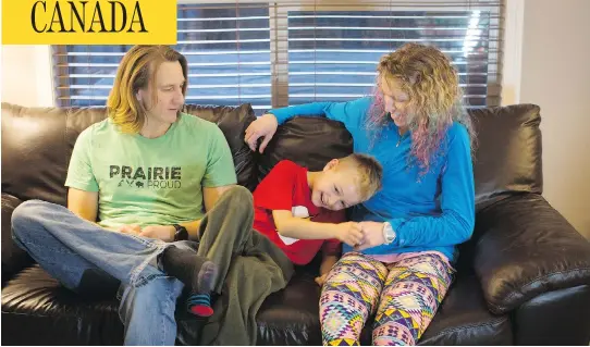  ?? TODD KOROL FOR NATIONAL POST ?? Angie Webster, right, and her husband Cole, left, are parents to Sydney, 7. Sydney was born female, but identifies as a boy and socially transition­ed before starting the second grade. The family says it has received strong support from the school and...