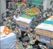  ?? NITIN KANOTRA/HT PHOTO ?? BSF personnel carry coffins of four of their colleagues martyred in Jammu and Kashmir on Tuesday.