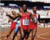  ?? MIKE POWELL / GETTY IMAGES 1988 ?? In what proved to be not such an impressive feat, Ben Johnson of Canada celebrates winning gold in the men’s 100-meter final after edging Carl Lewis at the 1988 Summer Olympics in Seoul, South Korea. Johnson was later disqualifi­ed for steroid use.