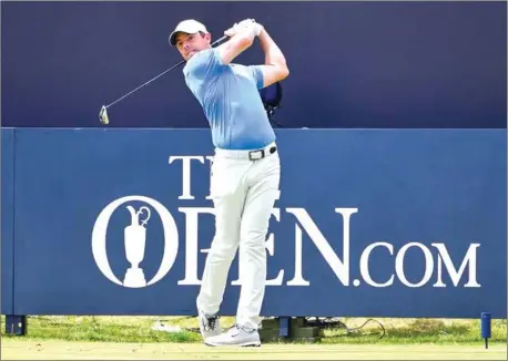  ?? PAUL ELLIS/AFP ?? Northern Ireland’s Rory McIlroy tees off from the first hole during a practice session at the 148th Open golf championsh­ip at Royal Portrush golf club in Northern Ireland on Tuesday.