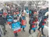  ??  ?? Striking Ontario teachers protest in downtown Toronto on Thursday.