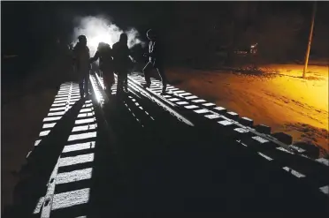  ?? Canadian Press photo ?? Eight migrants from Somalia cross into Canada illegally from the United States last week by walking down this train track into the town of Emerson, Man., where they will seek asylum at Canada Border Services Agency.