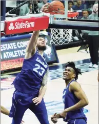  ?? David Butler II / Associated Press ?? Seton Hall forward Sandro Mamukelash­vili (23) makes a basket against UConn during a Feb. 6 game in Storrs.