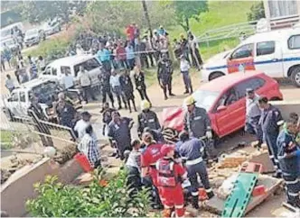  ??  ?? THE red VW Polo that ploughed into four workmen and a property in Phoenix in 2015, after the driver of vehicle allegedly failed to negotiate a sharp bend on a narrow street in the area.