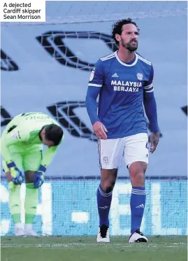  ??  ?? A dejected Cardiff skipper Sean Morrison