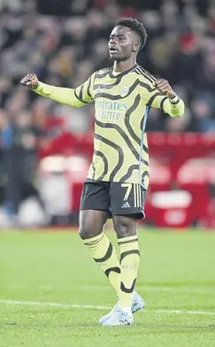  ?? ?? Bukayo Saka celebrates after scoring Arsenal’s second goal during the Gunners’ 2-1 win over Nottingham Forest in last night’s Premier League clash at the City Ground