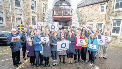  ??  ?? Gwynedd councillor­s marking Internatio­nal Women’s Day before a meeting of the full council