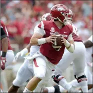  ?? NWA Democrat-Gazette/ANDY SHUPE ?? Quarterbac­k Ty Storey completed 25 of 39 passes for 230 yards and 2 touchdowns, and rushed 9 times for 36 yards as one of the bright spots for the Razorbacks in their 65-31 loss to No. 1 Alabama on Saturday.