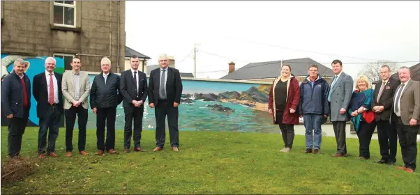  ??  ?? Artist Kate Kos with members of Gorey-Kilmuckrid­ge Municipal District at Gorey’s Civic Square.