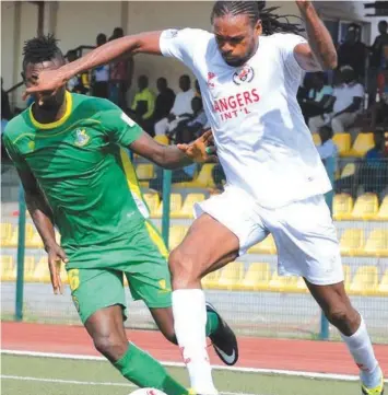  ??  ?? Kano Pillars’ Auwal Malam vies for the ball against Enugu Rangers’ Michael Uchebo during a recent NPFL game. Kano Pillars will play in their second consecutiv­e final of the Aiteo Cup in Kaduna…this weekend.